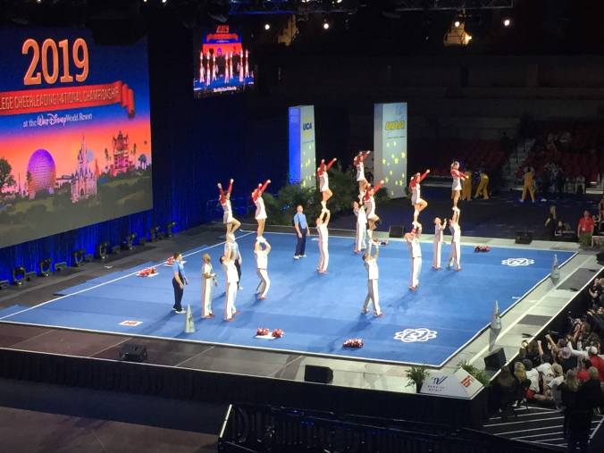 a coed squad performs at the college cheerleadiing national championships
